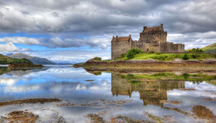 Scotland-waterways-Eilean-Donan-castle-on-a-cloud Sail the waterways of Scotland with River Cruise Your Way